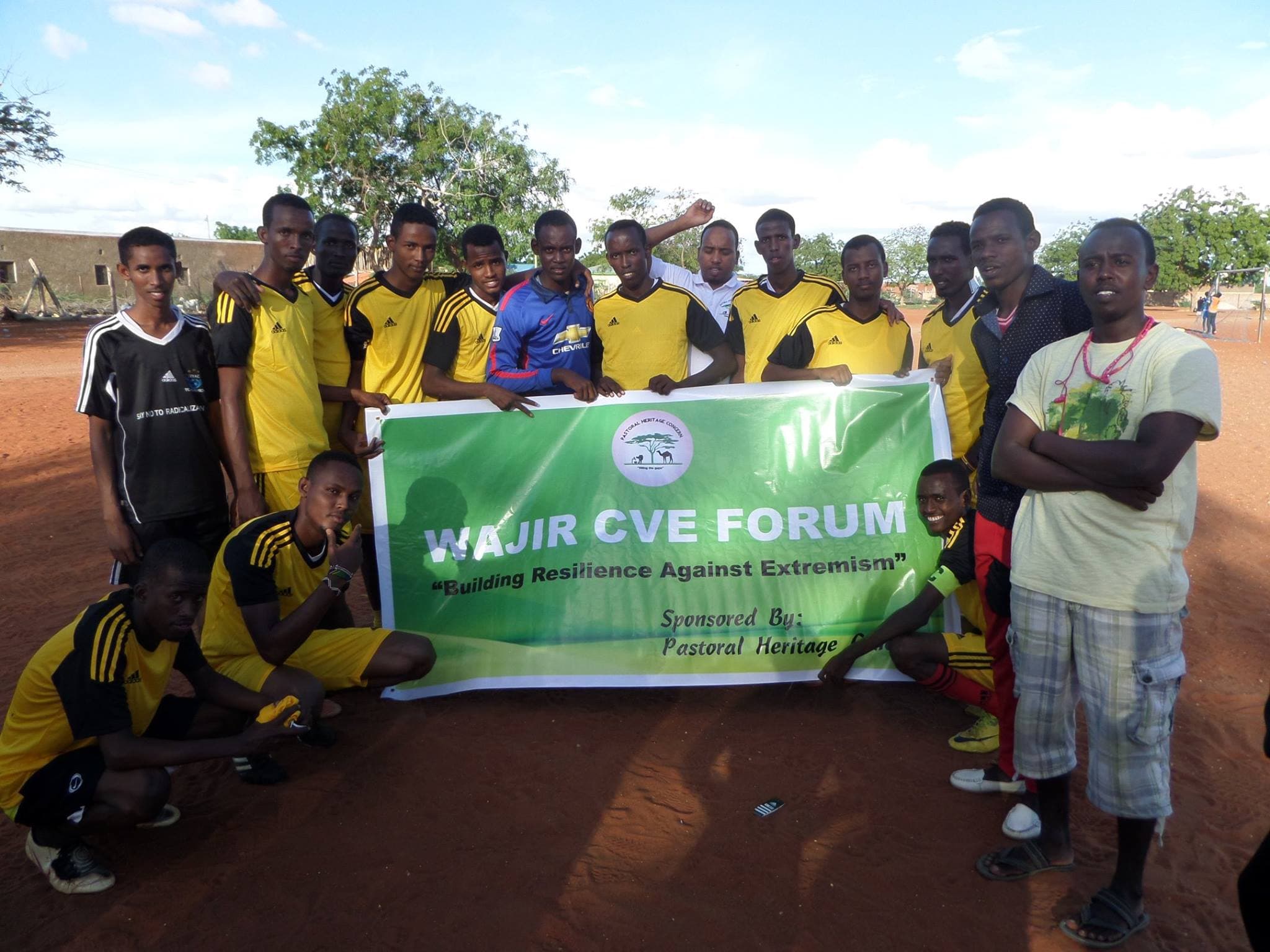 Youth participants posing with the Wajir CVE Forum banner