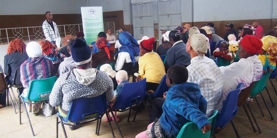 Community forum with families seated during a public session